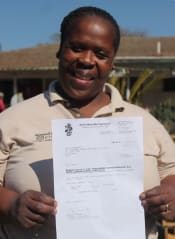 nurse holding her first year results certificate