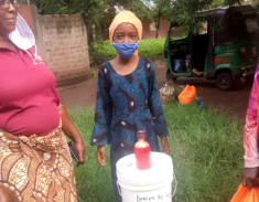 Child with Covid mask & sanitiser